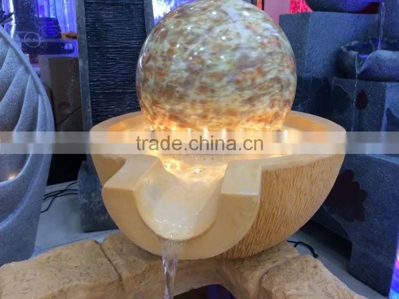 LED yellow light color resin and sandstone fountain with ball