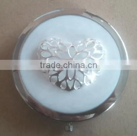 black handmade compact mirror with metal octopus decor