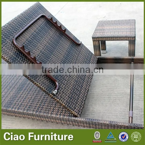 Outdoor used beach sun lounger with side table