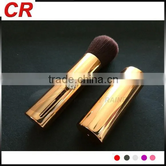 Golden cosmetic brush portble use with beautiful crystals