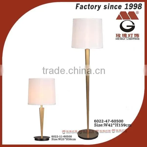 gold metal standing lamp