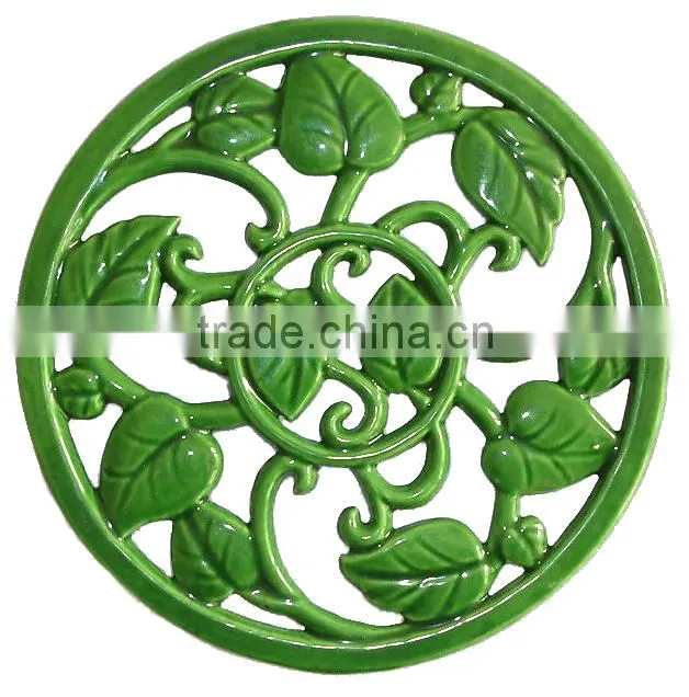 green leave leave cast iron cooking trivet