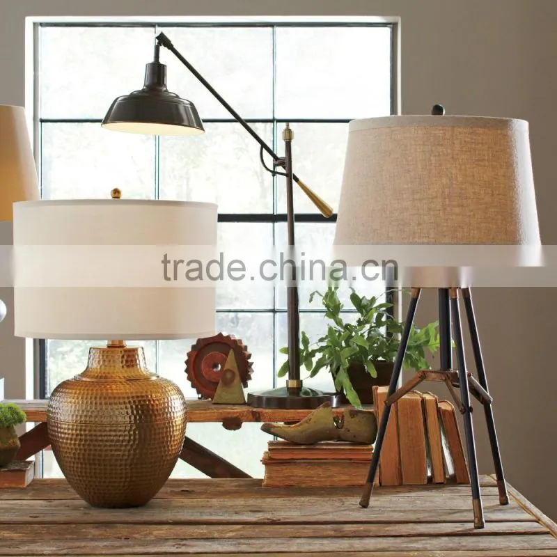 11.21-10 Crafted with a traditional silhouette adjustable arm Table Lamp bronze finish for versatility and charm