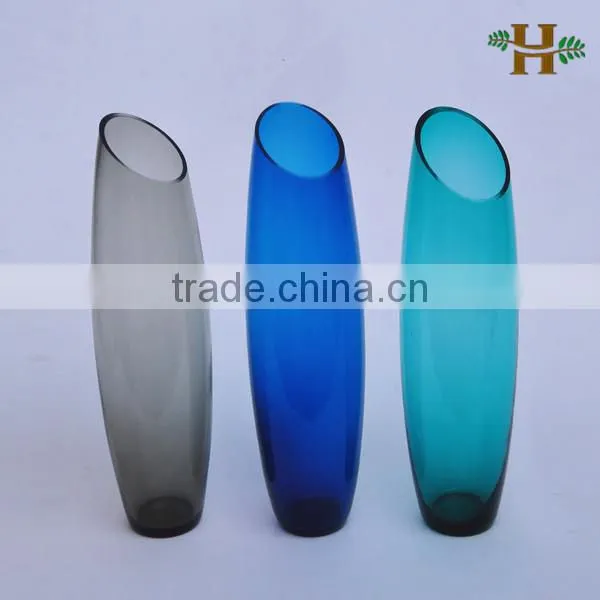 inclined tall colored glass vases