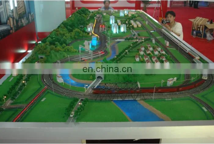 Ho scale model railroad with train cars and mini figures