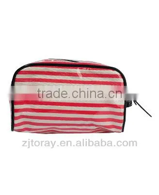 Small clear coated cosmetic bag featuring a coated stripe pattern zippered placket along the top