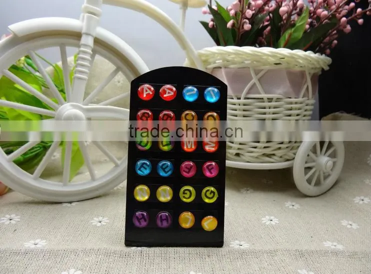 Oil drops adhesive letters stud earrings