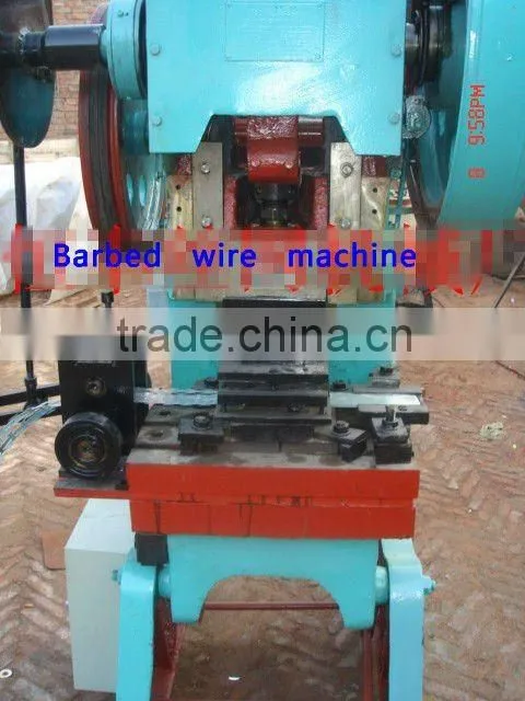 Barbed wire making machine