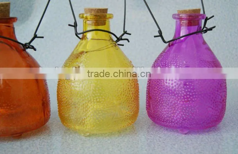 middle size colored glass wasp bottle