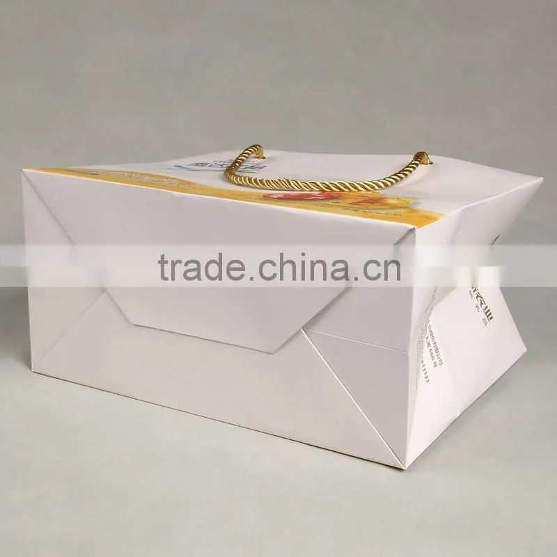 New design paper hand bag with deep space and golden handle for health protection products