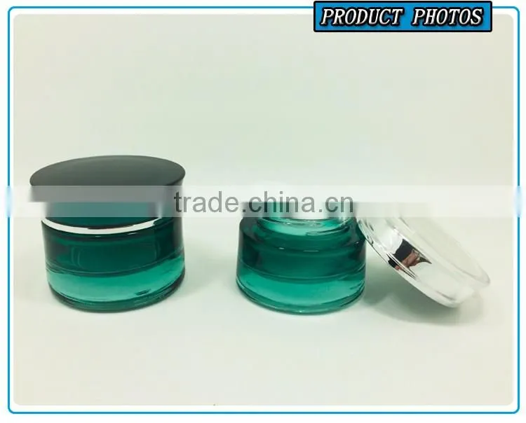 Green coloured cosmetic glass bottle and cosmetic glass jar