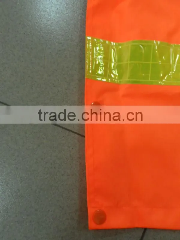 high visibility orange safety rainsuit with yellow plastic tapes