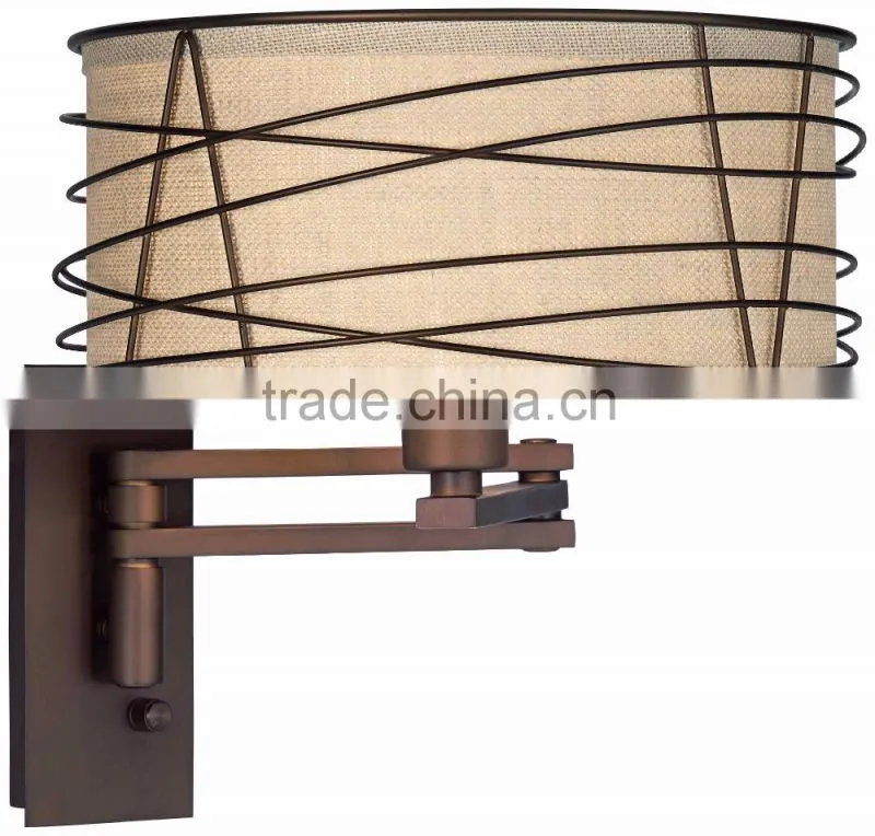 1031-1 wire cage detail surrounds a burlap shade a rich Bronze Metal Swing Arm Wall Lamp