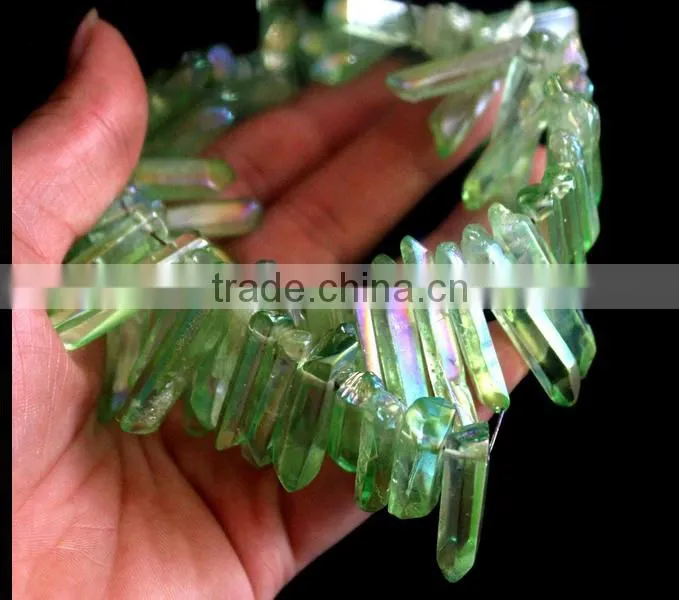 Green aura of titanium coating on quartz crystal necklace for healing