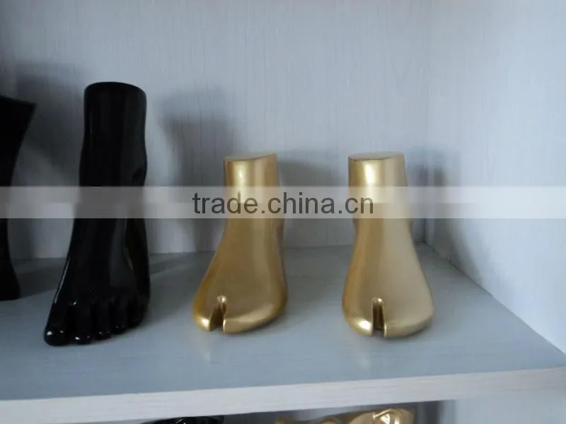 Fashion shoes display Golden mannequin feet and foot
