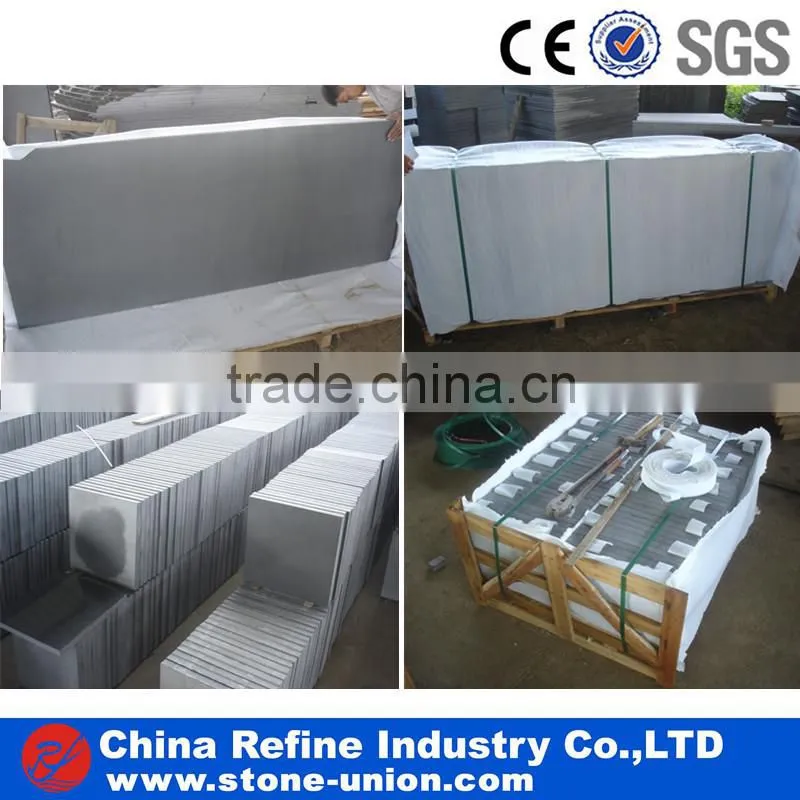 Bush-hammered finished grey basalt cube