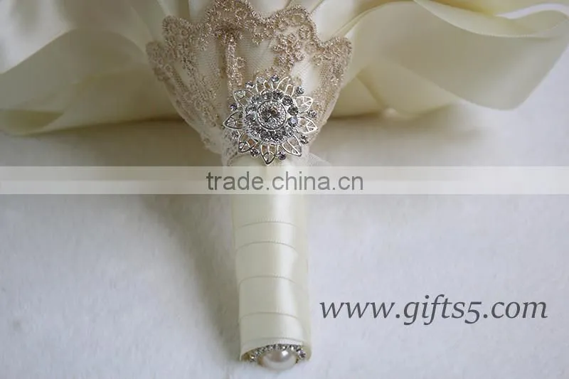 Romantic wedding bouquet full of crystal beads and green brooches