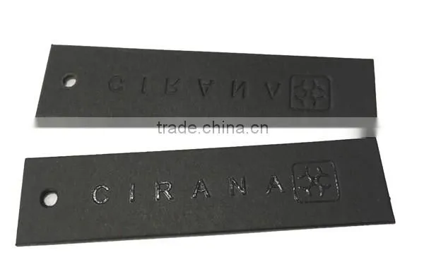 black hang tag with gold stamping