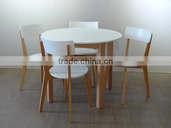 white solid wooden round dining table