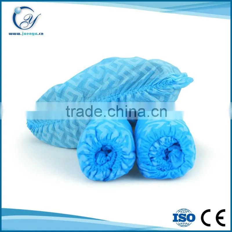 Non-skid disposable nonwoven shoe cover