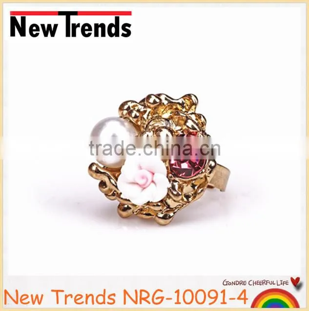 Fancy flower pearl gold ring designs with large crystal