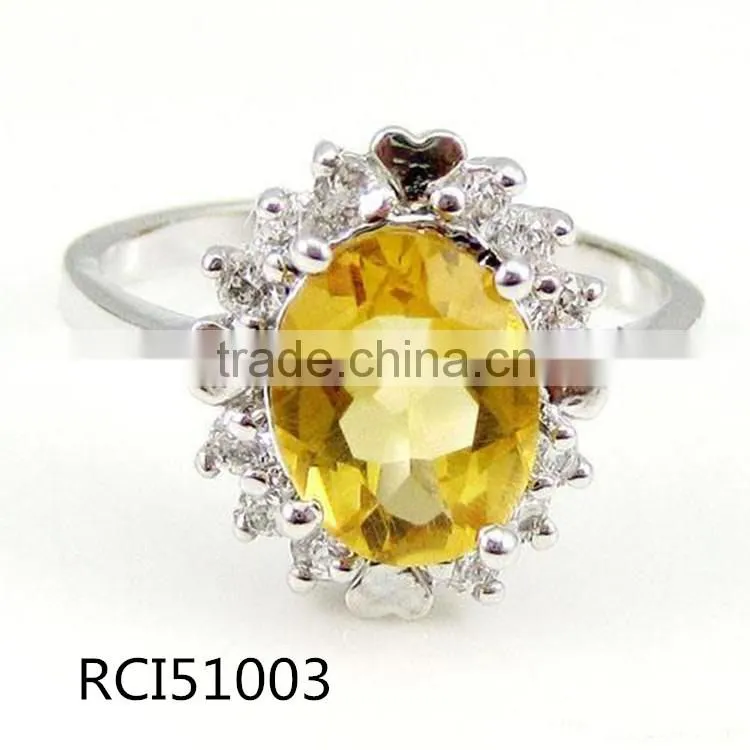 Ring sterling silver and citrine 7x9mm faceted oval with twelve-rhinestone
