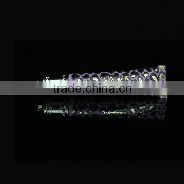 Black lipstick tube with crown cap with foil printing