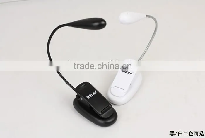 Extra-Bright 4 LED Book Reading Light Easy Clip 2 Brightness Settings, Soft Padded Clamp. Perfect for Bookworms