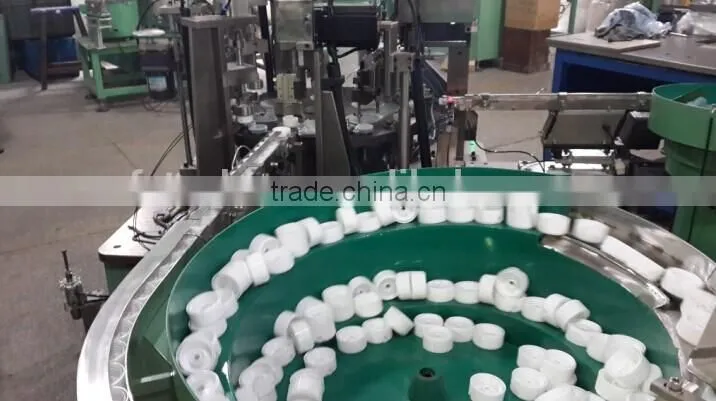 Automatic plastic cap assembly manufacturing machine