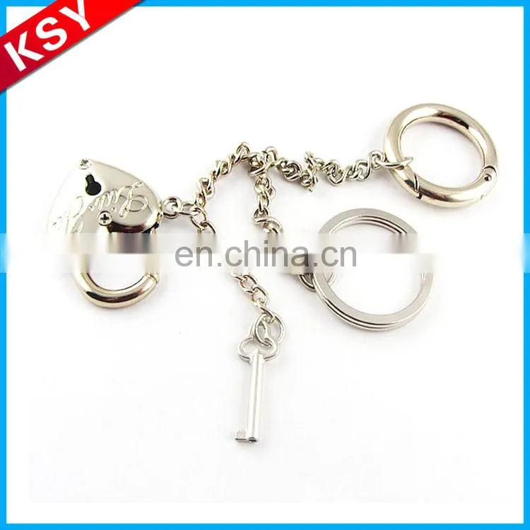 polished nickel key shape keychain