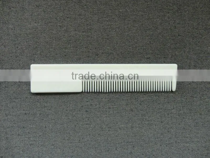 white plastic straight hotel comb