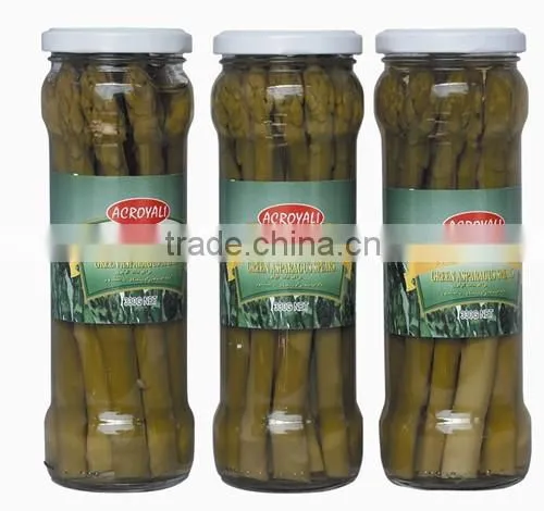 Green asparagus spears in glass jar