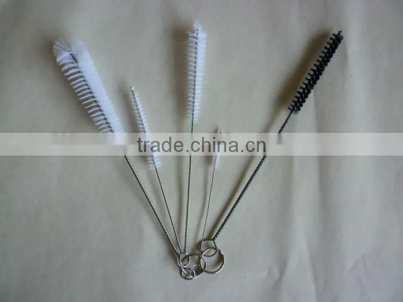 Twisted-in-wire cleaning brushes