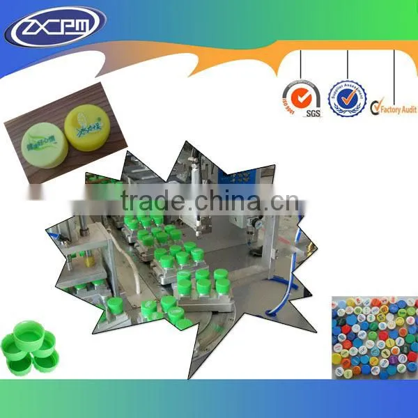 Bottle caps pad printer with conveyor