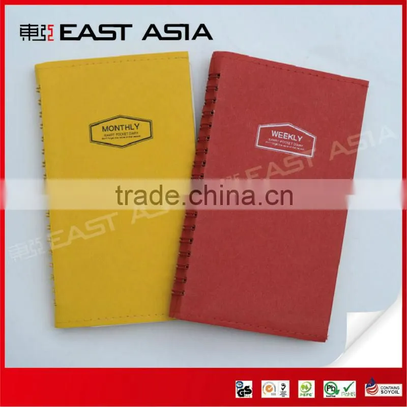 red specialty paper cover notebook with spiral binding