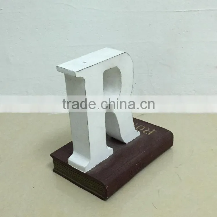 Polyresin book with letter figure