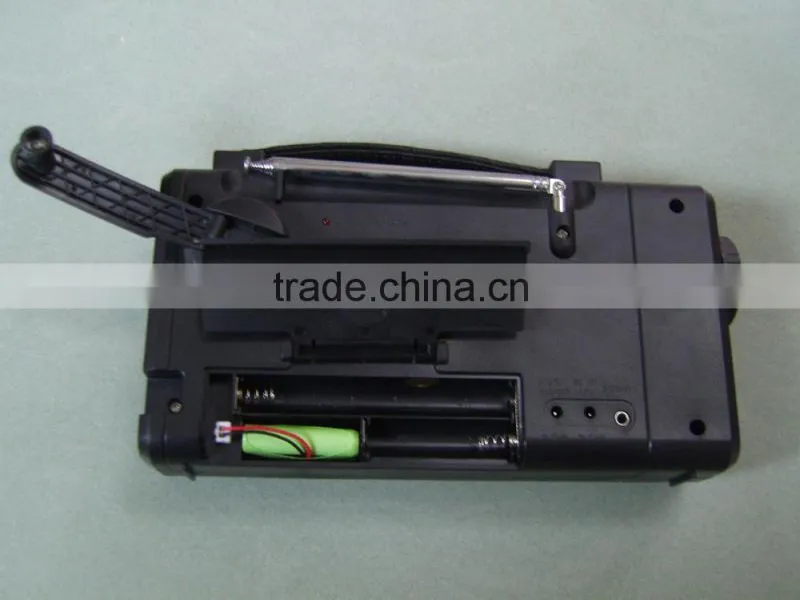 Hand rechargeable with flashlight radio