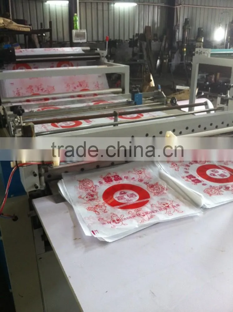 Economic type cake or bread oil on paper roll to sheets cutting machine