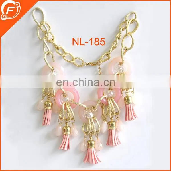 women dressing metal chain necklace with tubes
