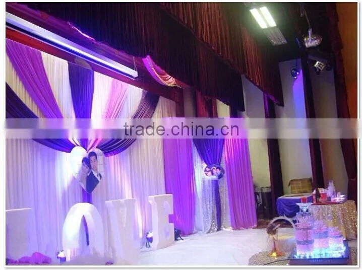 fancy and elegant pipe and drape wedding backdrop