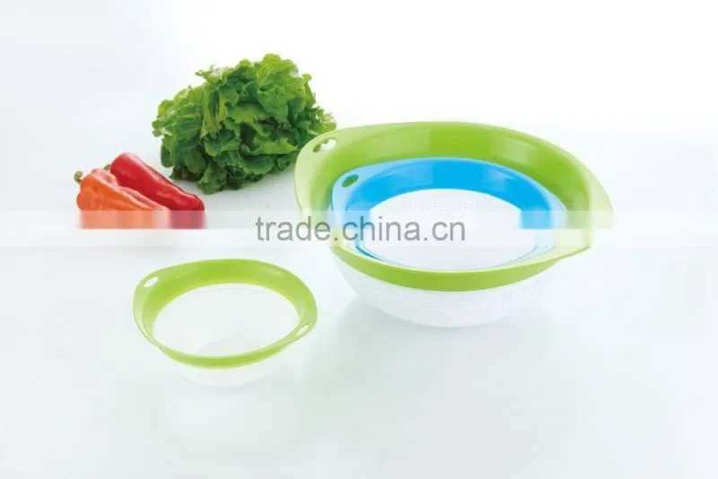 green and blue color plastic rice sieve