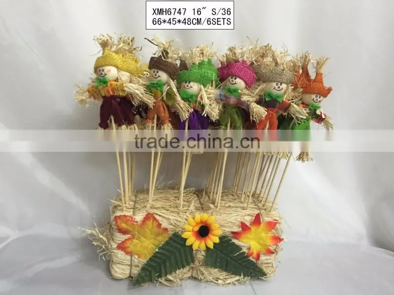 Straw and fabric scarecrow witch for halloween decoration