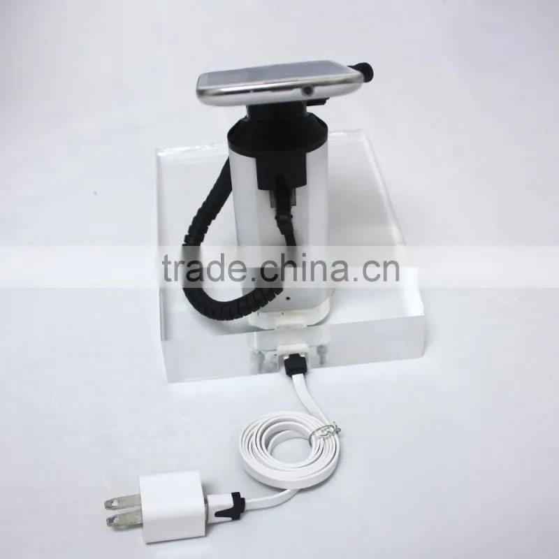 Alarm and charging of cell phone display holder