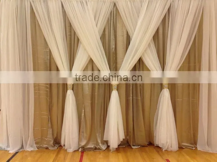 fancy and elegant pipe and drape wedding backdrop