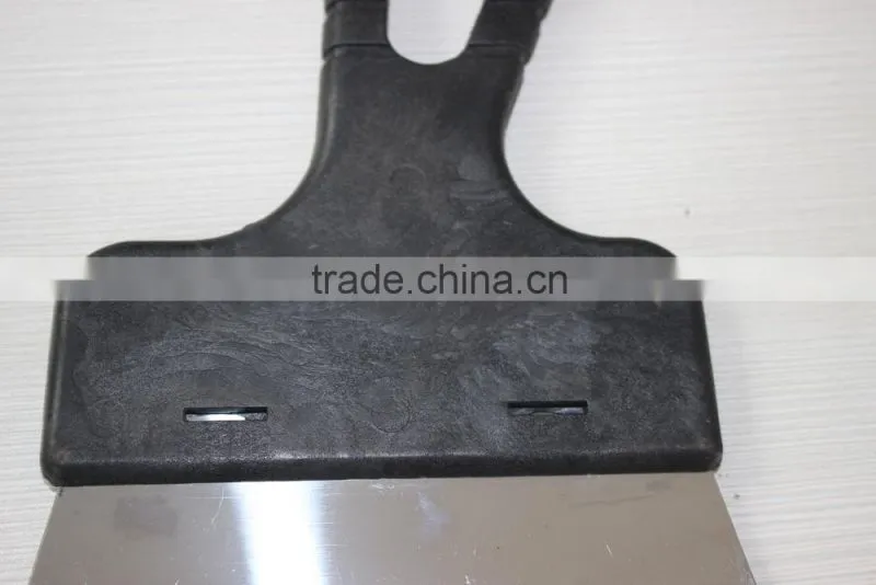 Wall scraper with PC handle