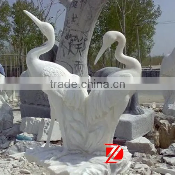 white stone crane sculpture