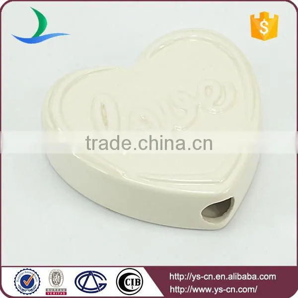 heart shape ceramic decoration with love relief