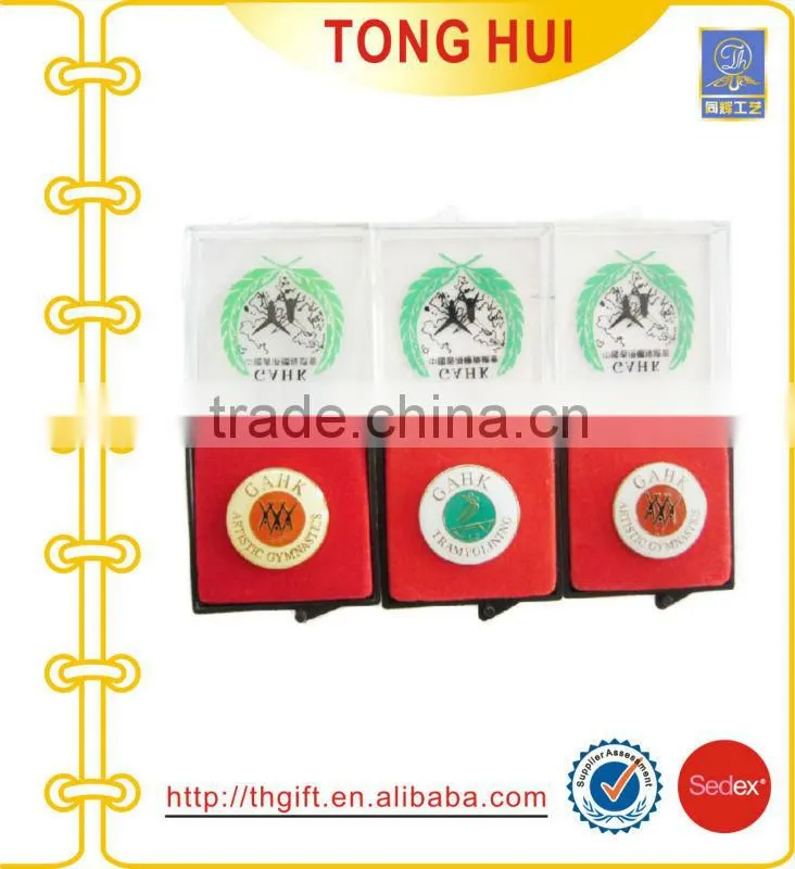 Metal badges with fan-shaped design