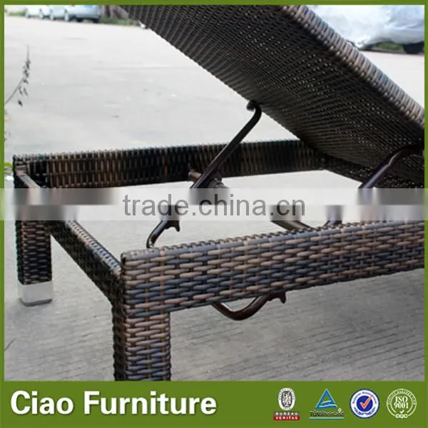 Outdoor used beach sun lounger with side table