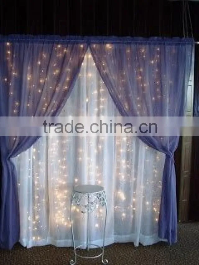 fancy and elegant pipe and drape wedding backdrop